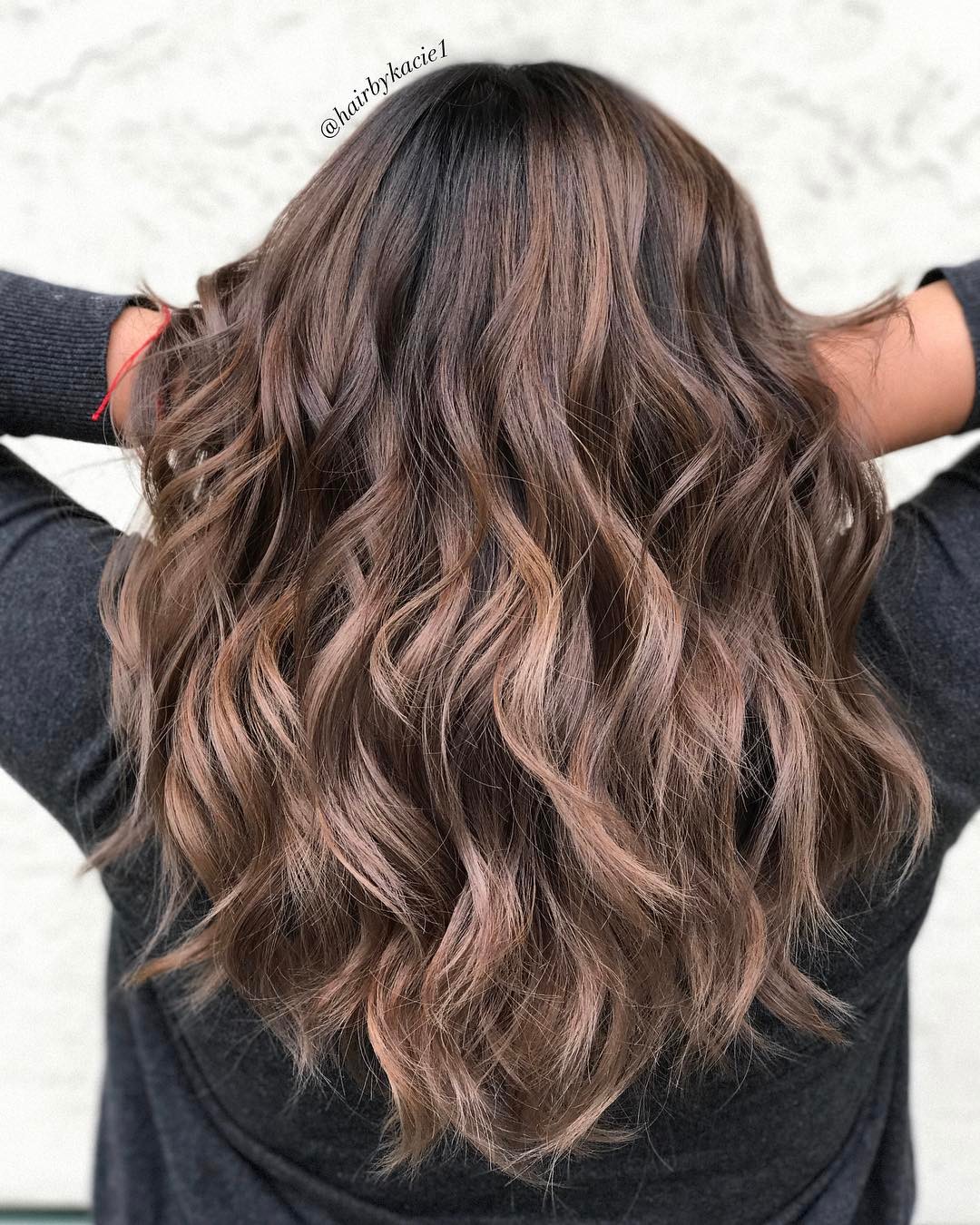 Mid-Back Wavy Layered Hairstyle