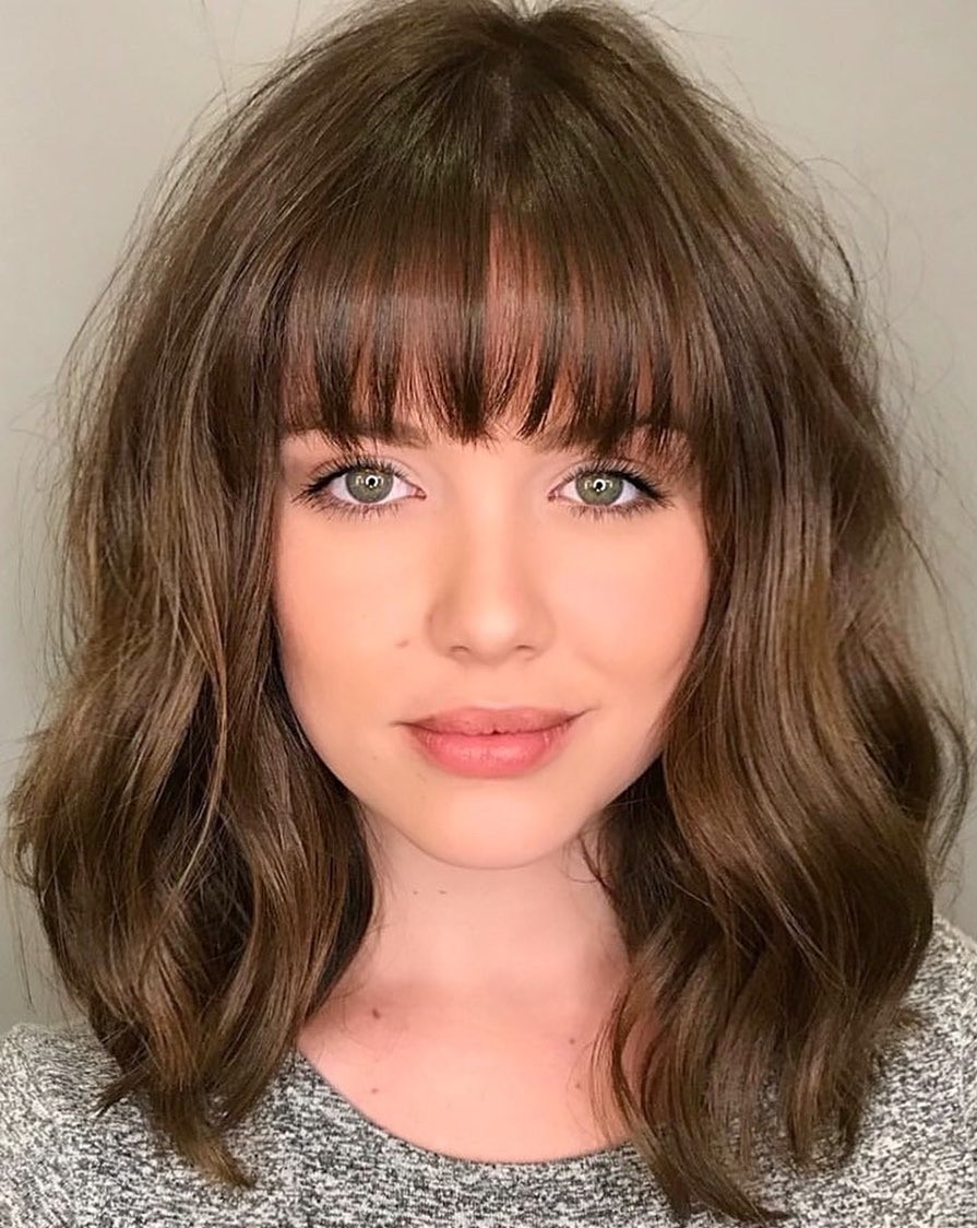 Medium Wavy Hair with Straight Bangs