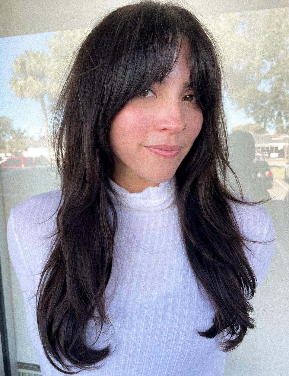 Long Hair with a Middle Part and Curtain Bangs
