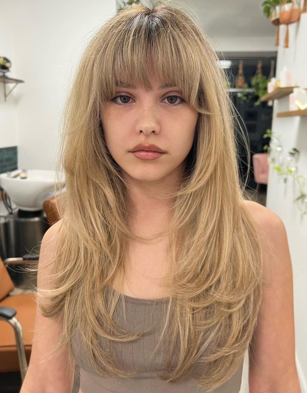 Long Feathered Hair with Brow-Grazing Bangs