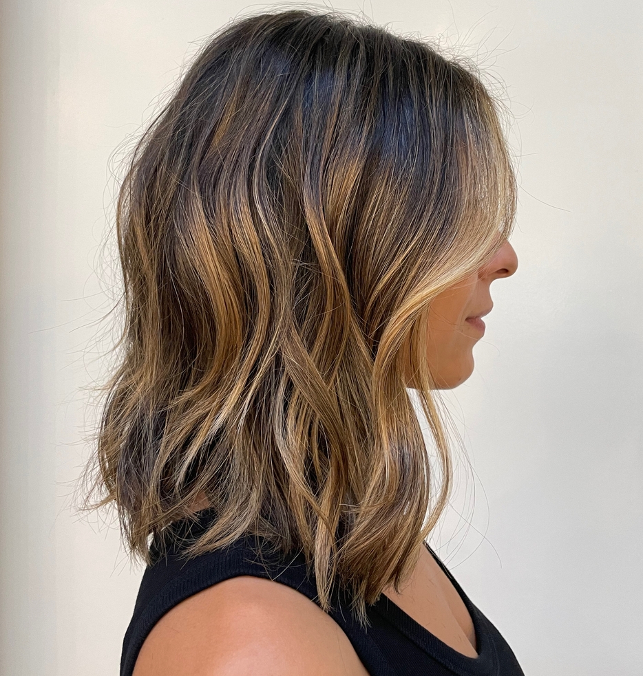 Medium Brunette Haircut with Golden Highlights