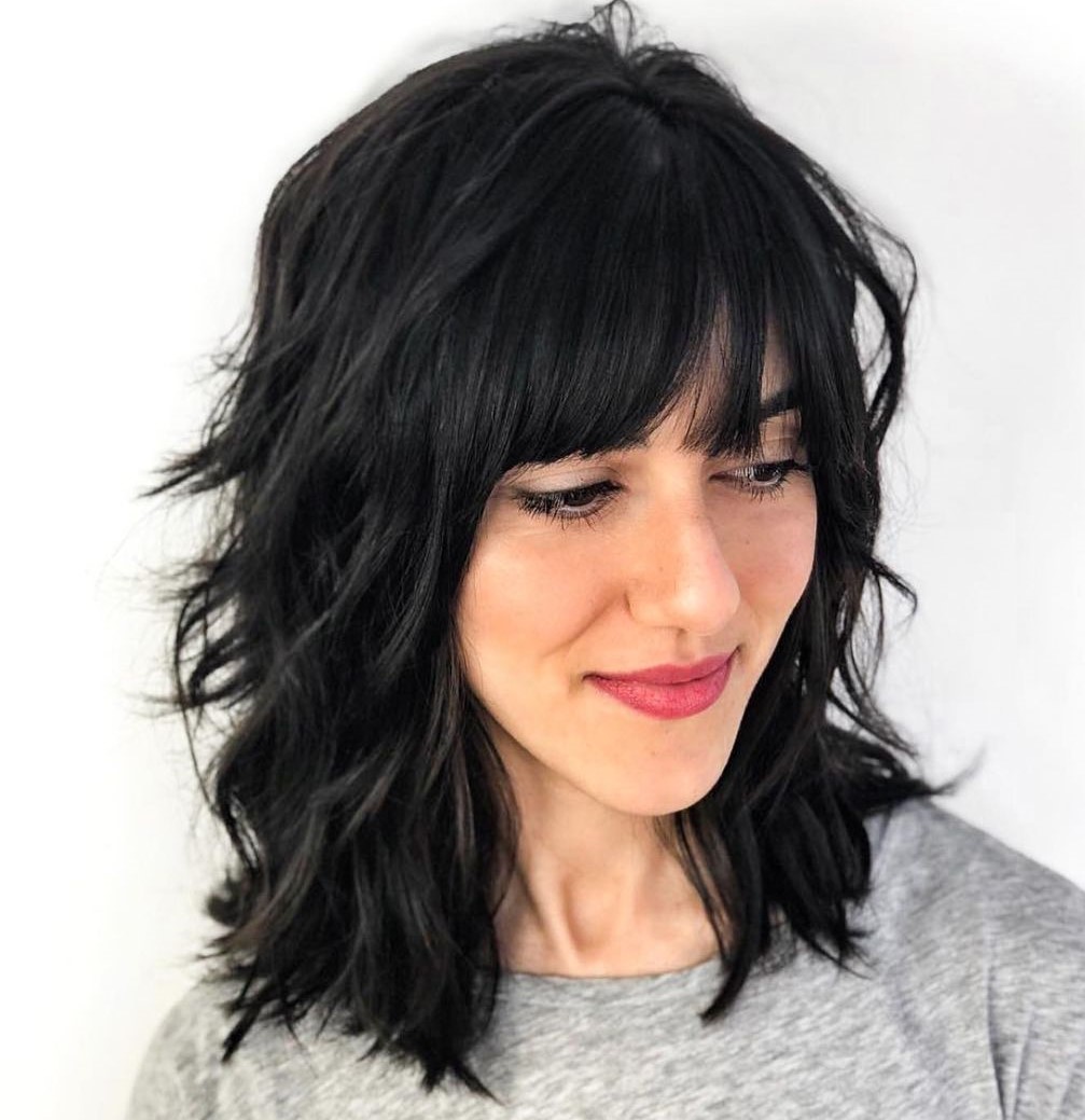 Medium Layered Hairstyle with Bangs