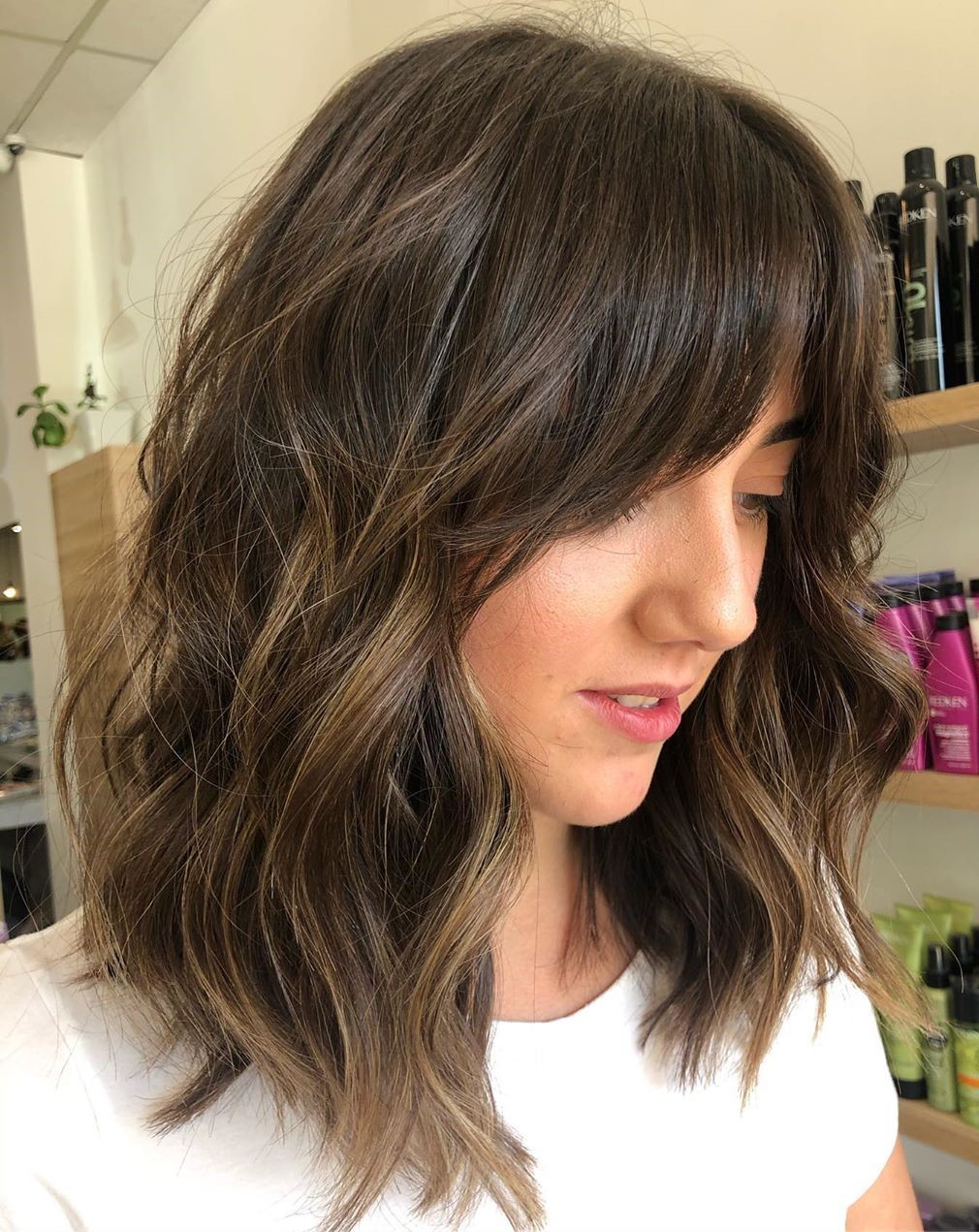 Shaggy Shoulder-Length Haircut with Bangs