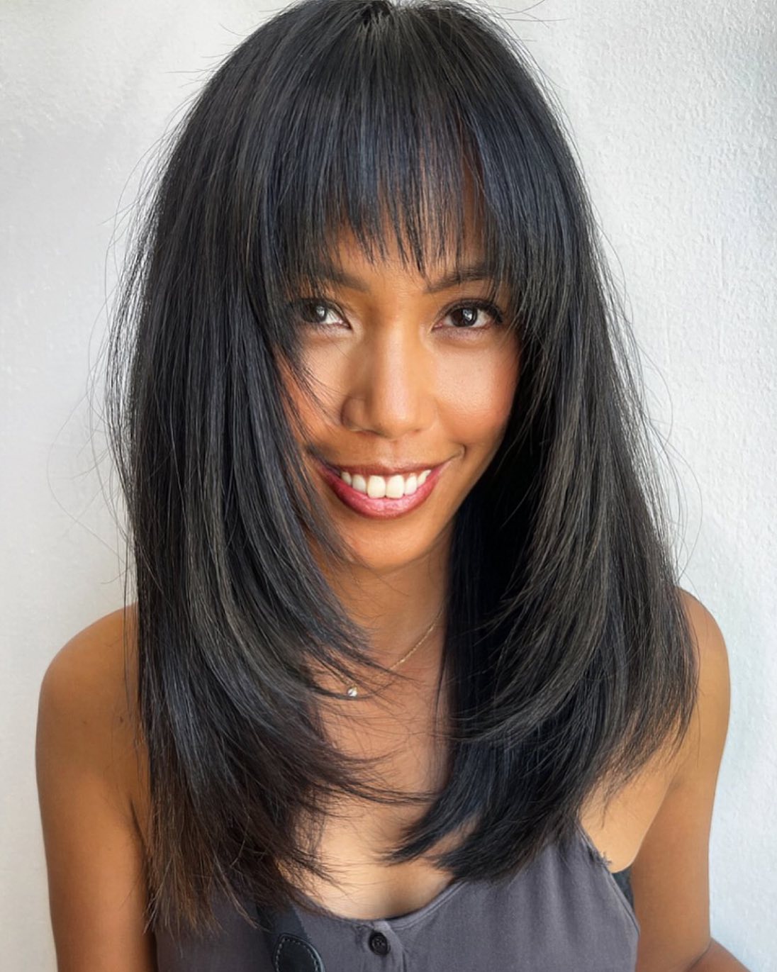 Straight Haircut with a Feathered Fringe