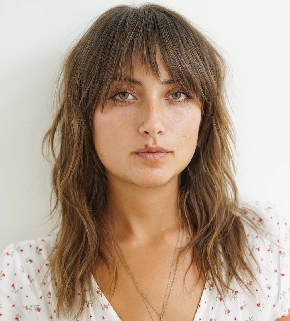 Medium Shaggy Hairstyle with a Layered Fringe