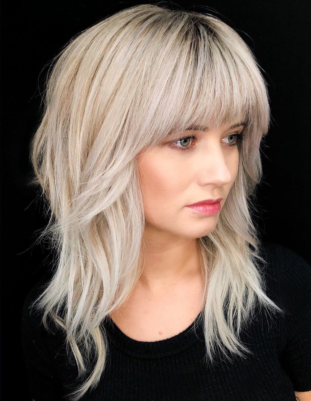 Medium Haircut with Bangs for Women