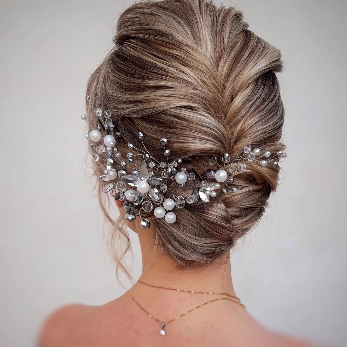 Chic Wedding Updo with a Hairpiece