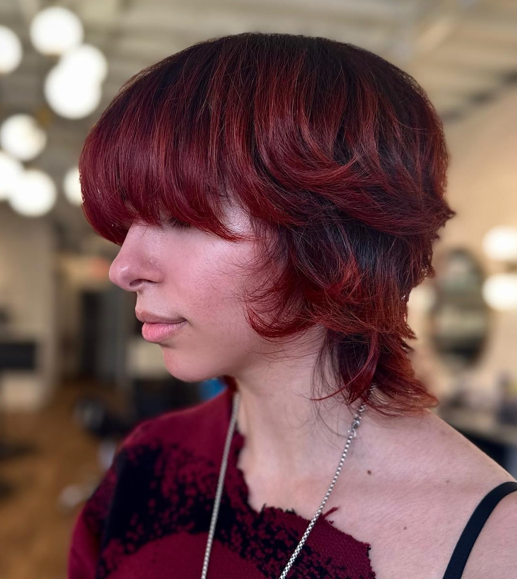 Short Red Wolf Cut with Black Roots