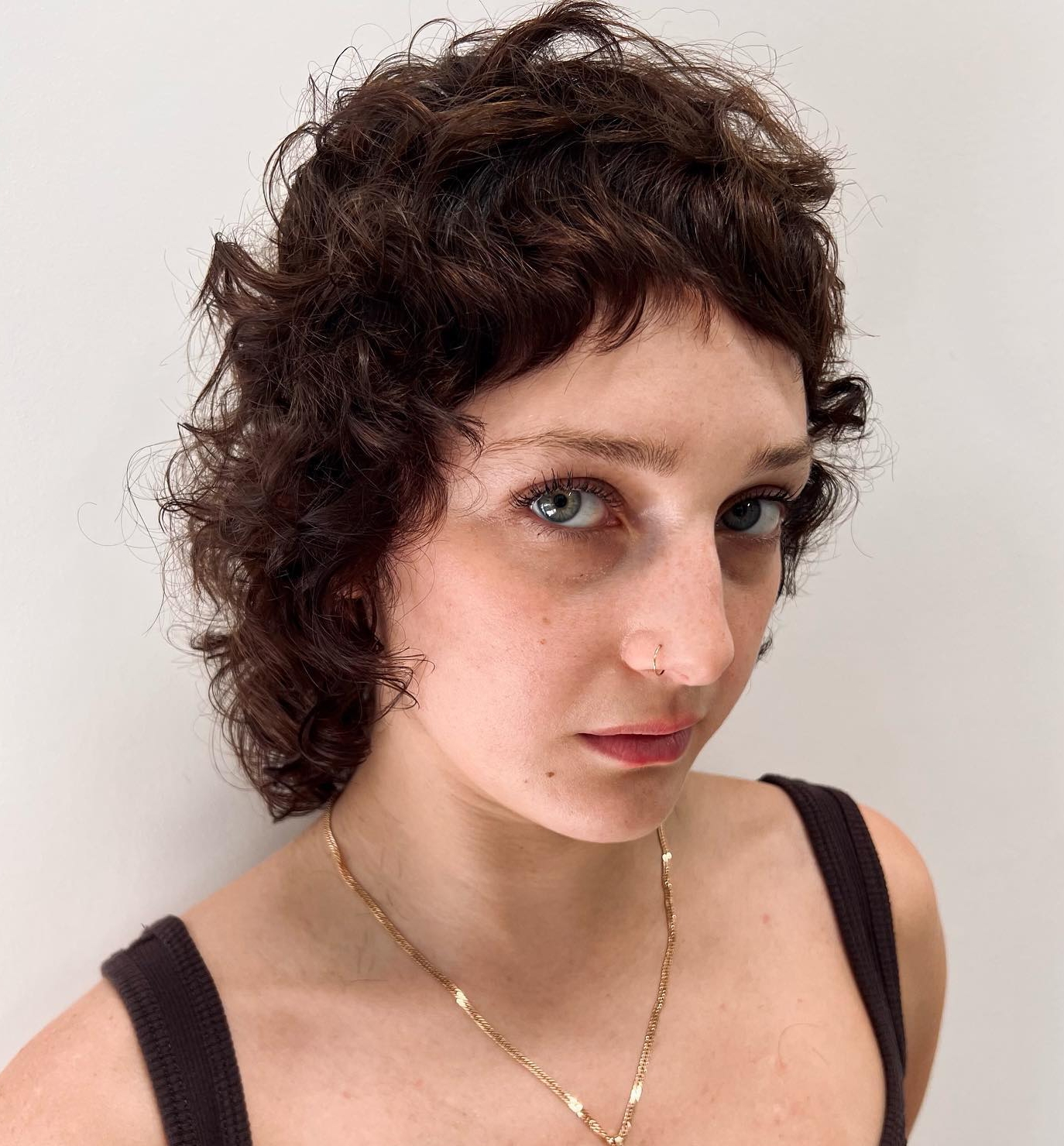 Short Wolf Cut with Bangs for Curls