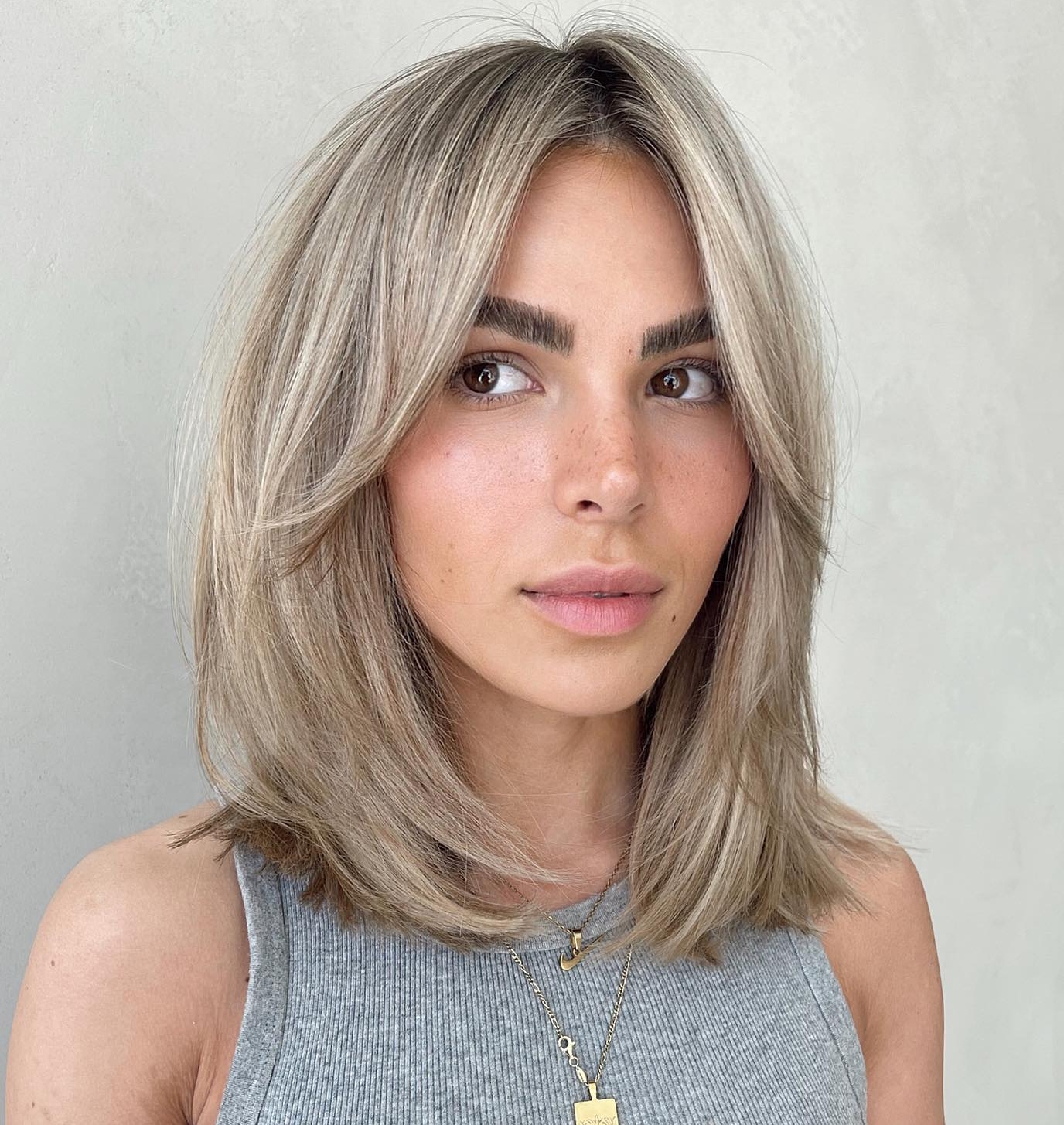 Medium Hairstyle with Bangs for Thick Hair