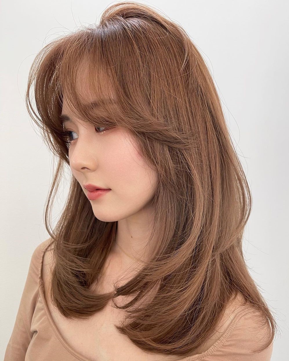 Asian Shoulder-Length Hairstyle with Curtain Bangs