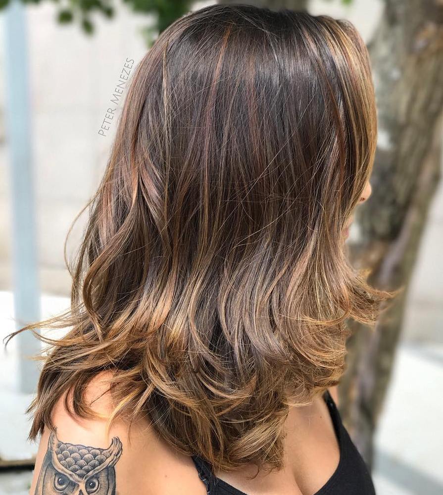Medium Razored Hairstyle with Golden Streaks