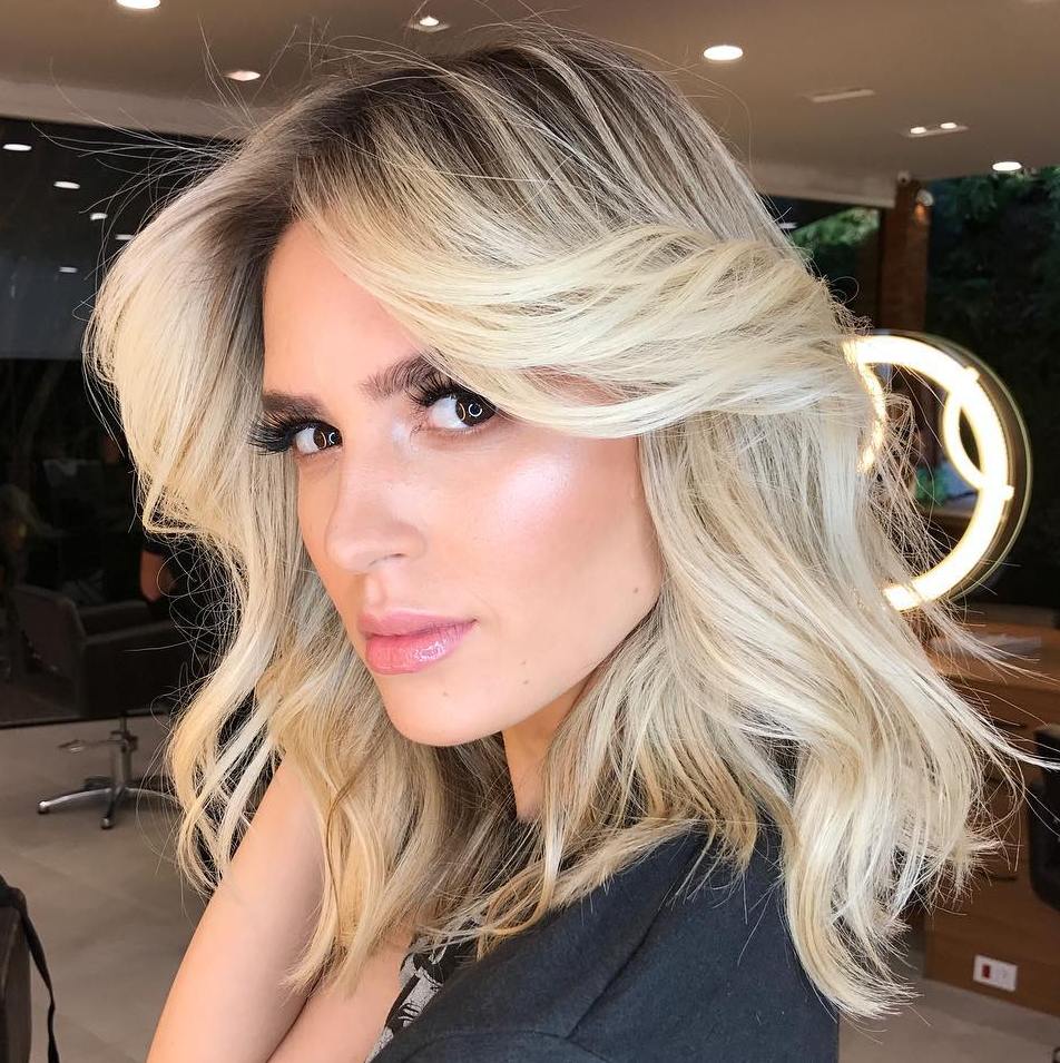 Medium Hairstyle with Long Side-Swept Bangs