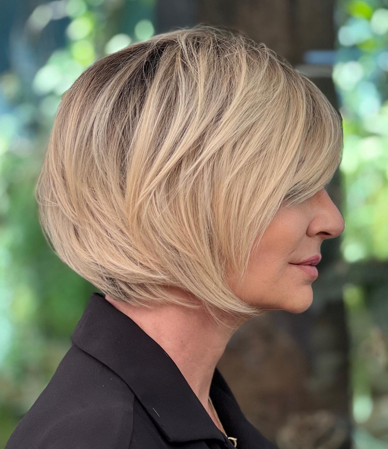 Elegant Layered Rooty Blonde Bob