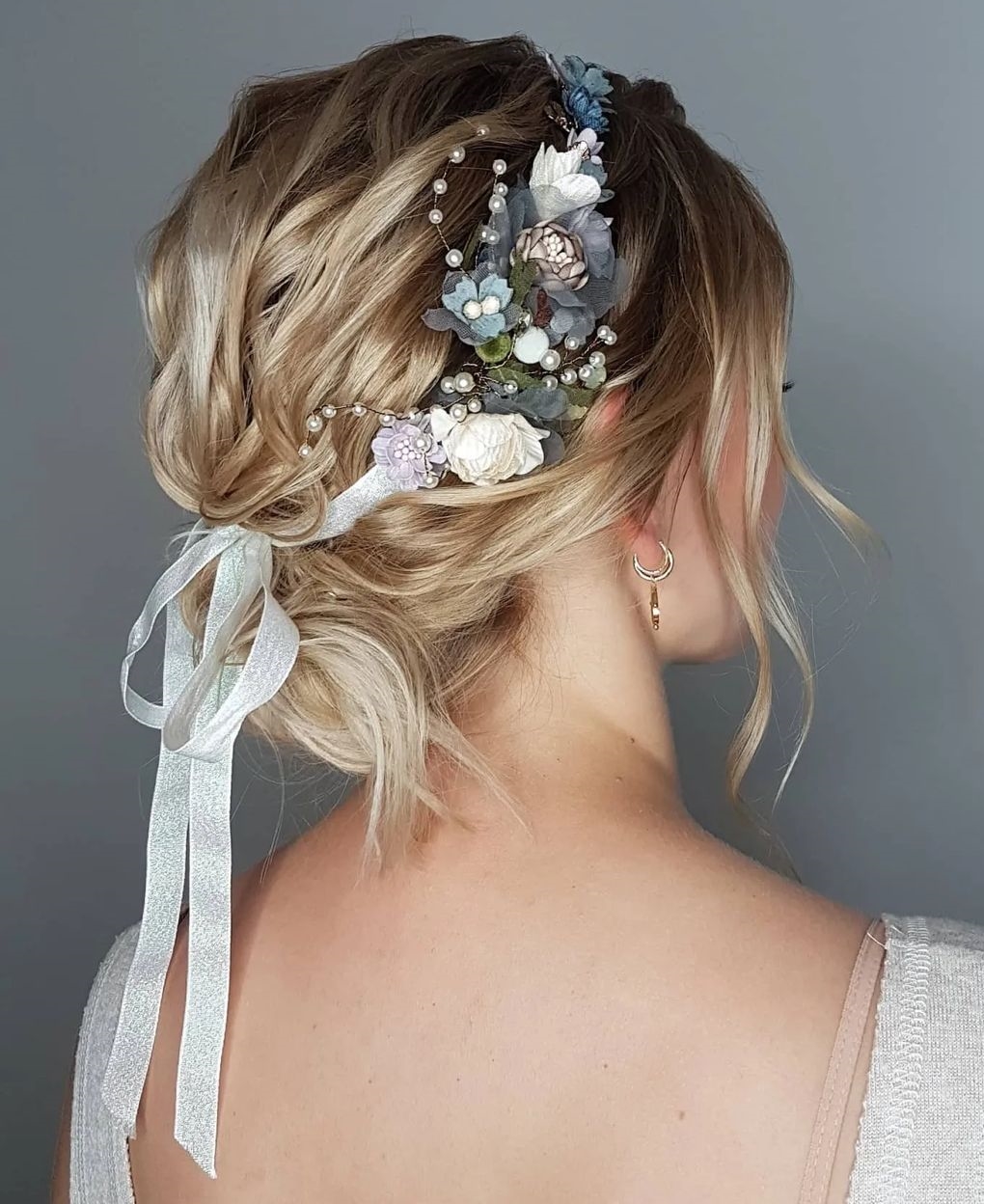 Low Tousled Bun with a Wedding Headpiece