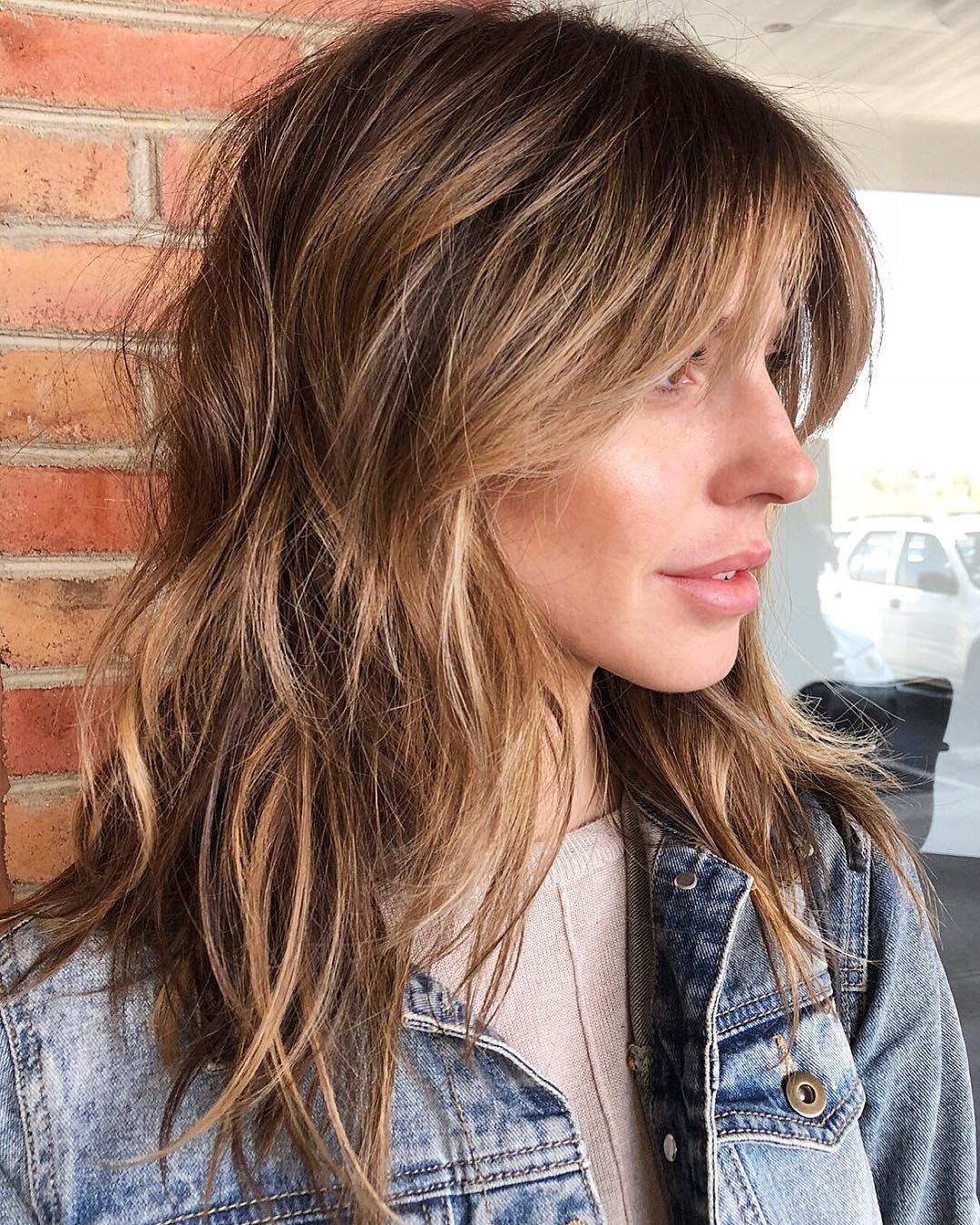 Medium Shaggy Haircut with Swoopy Bangs
