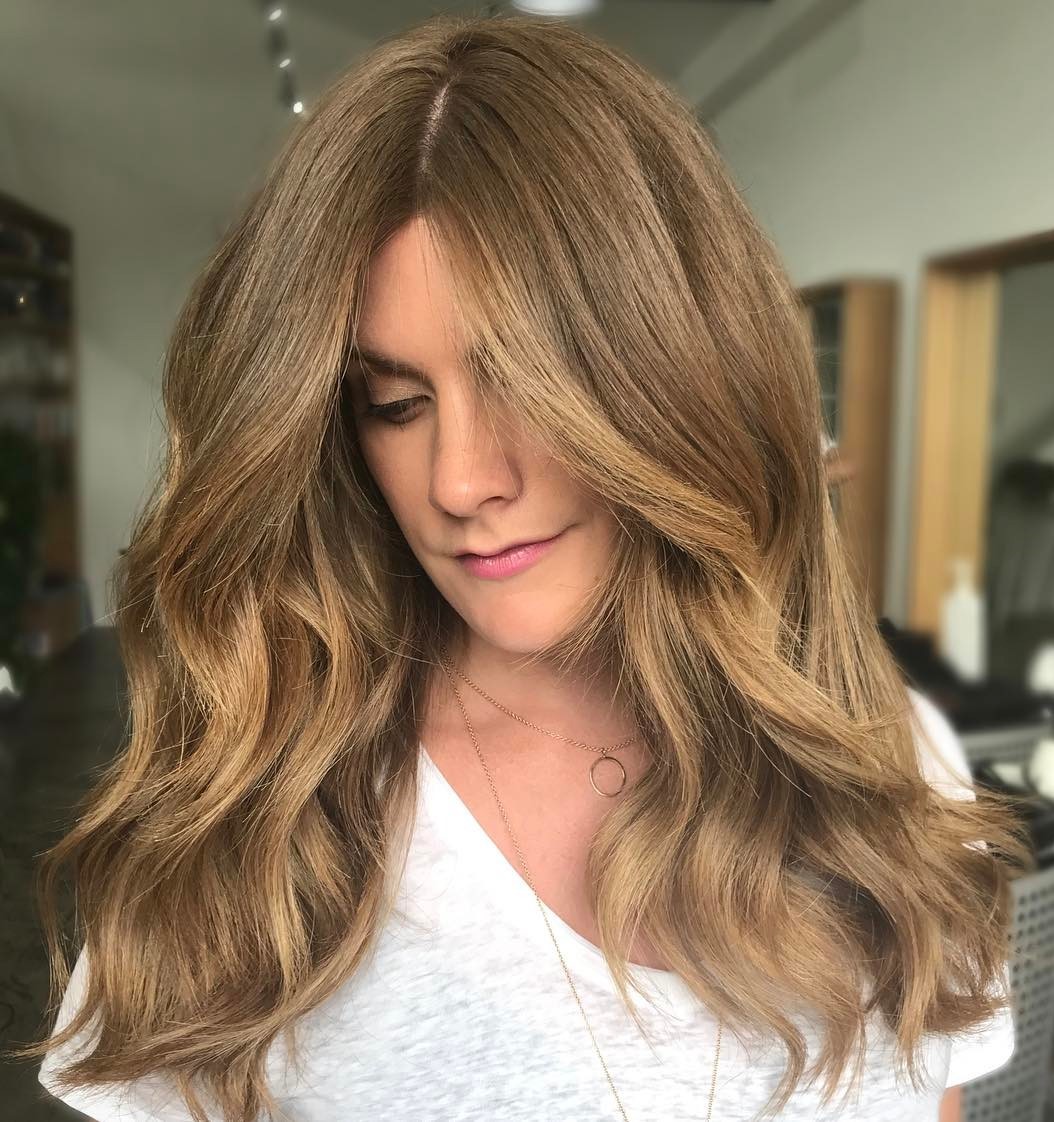 Warm-Toned Thick Hair with a Middle Part
