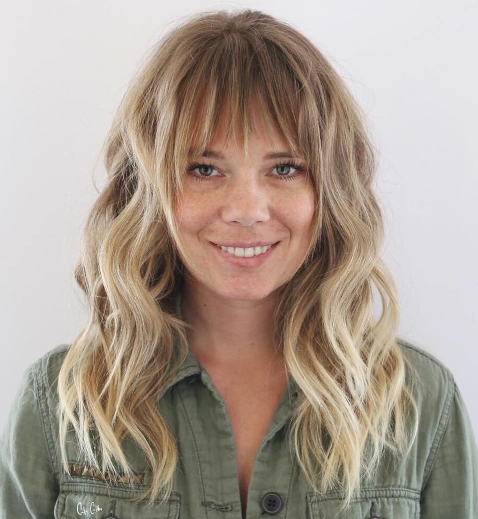 Long Highlighted Hairstyle with Bangs for a Big Wide Nose