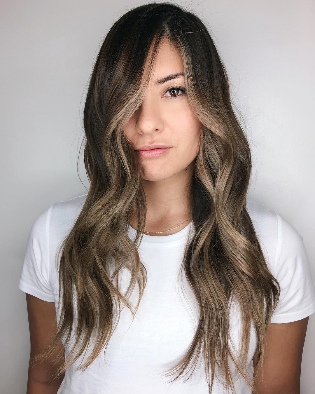 Long Cut with Choppy Ends and Face-Framing Highlights
