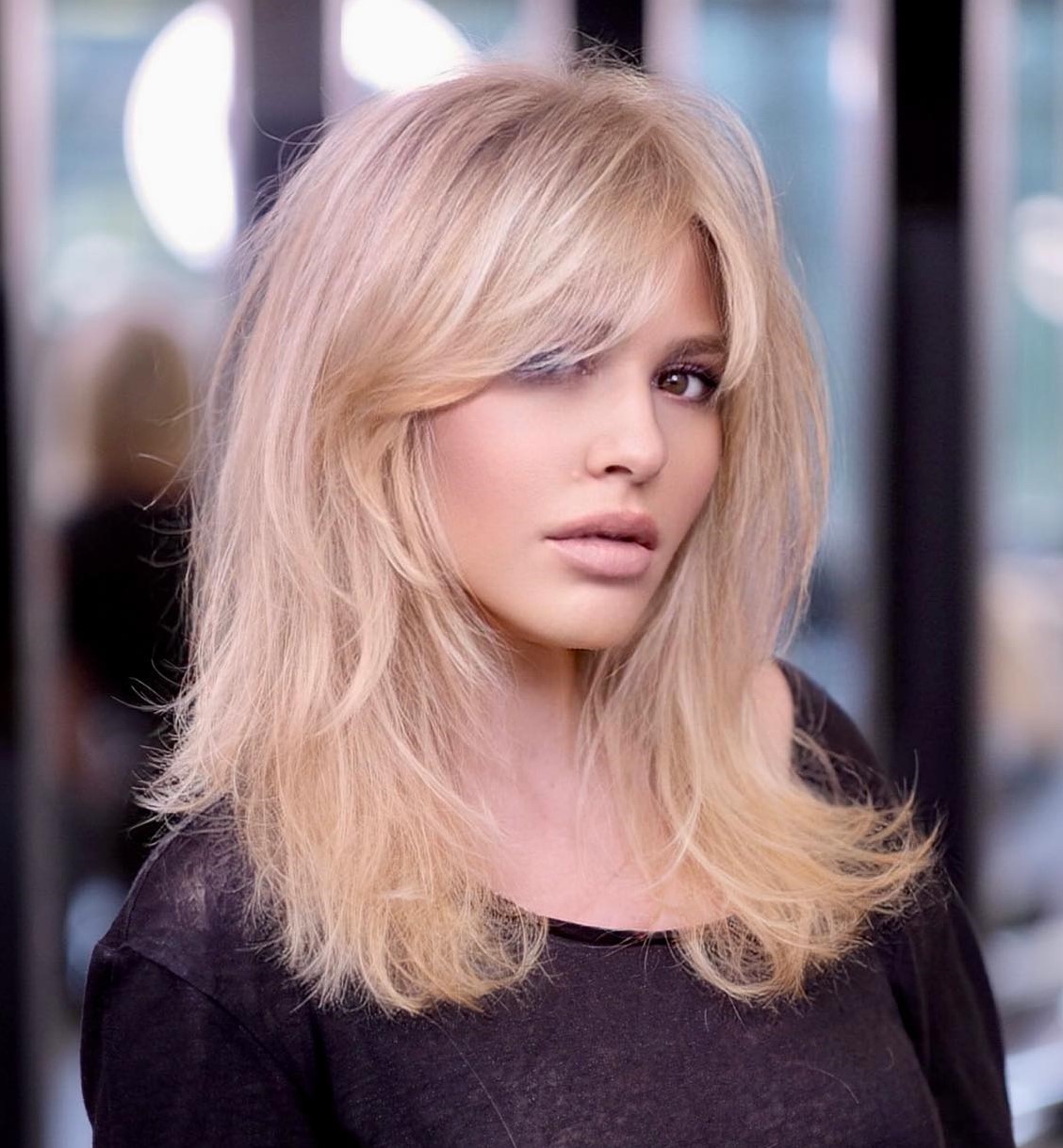 Medium Wispy Blonde Hair with Curtain Bangs